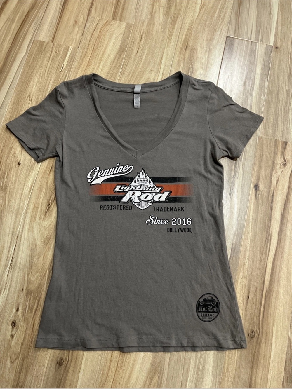 Dollywood Genuine Lightning Rod V-Neck Tee in Brown with Red Accenti